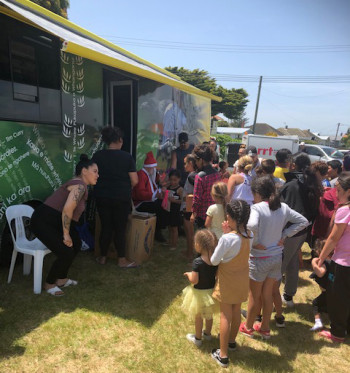 mobile library mobile library bus with children waiting outside