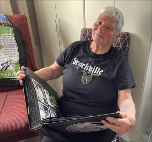 A person looking at photos in an album.